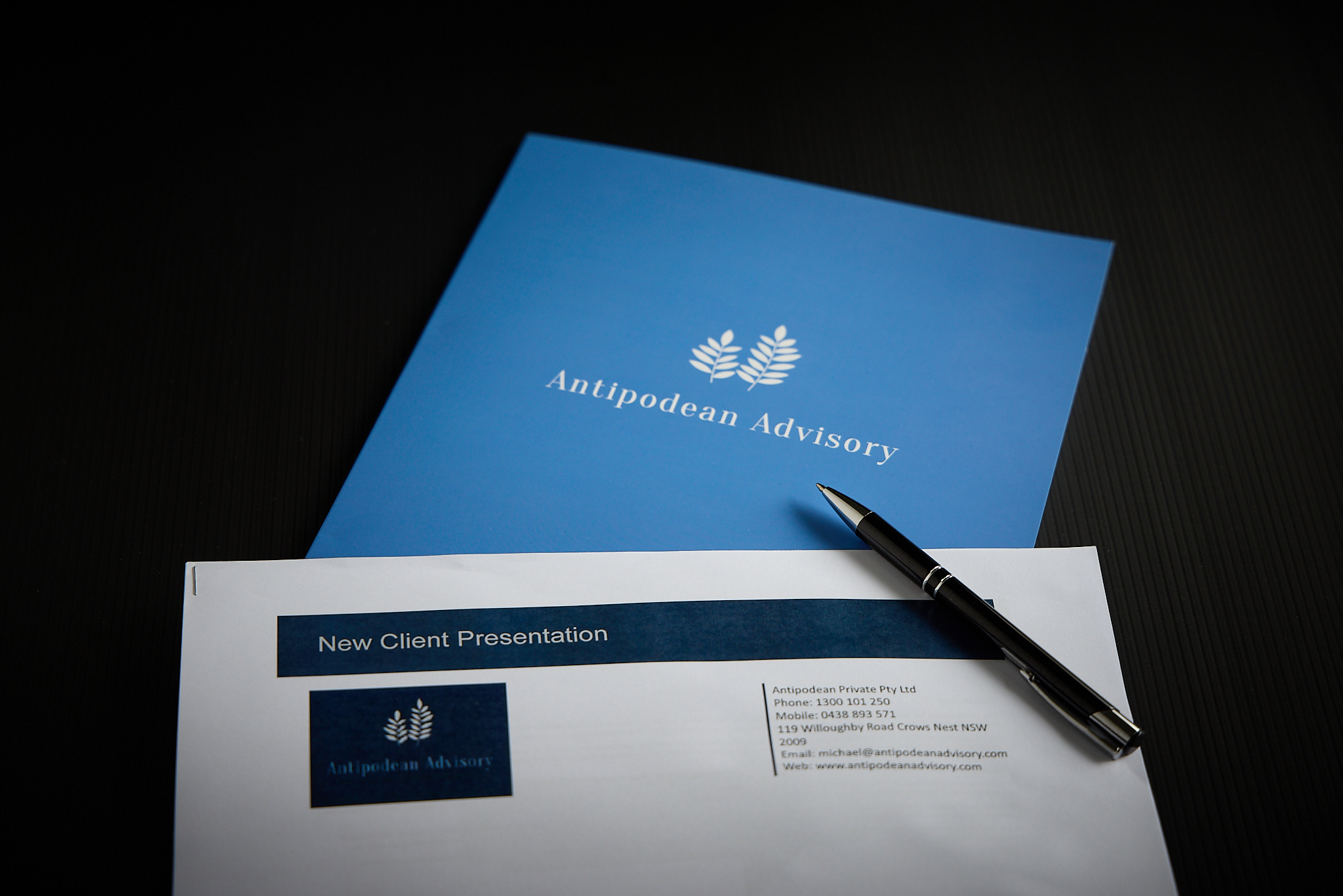 Blue brochure with Antipodean Advisory